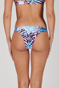 Tide + Seek Sustainable swimwear model wearing our Jungle Disco Cheeky Coverage Bikini Bottom