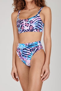 Tide + Seek Sustainable swimwear model wearing our Jungle Disco High Waisted Bikini Bottoms and Fitness Bikini Top