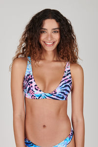 Tide + Seek Sustainable swimwear model wearing Jungle Disco Triangle Plunge Bikini Top
