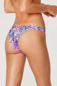 Tide + Seek Sustainable swimwear model wearing Purple Lava Cheeky Coverage Bikini Bottom back view
