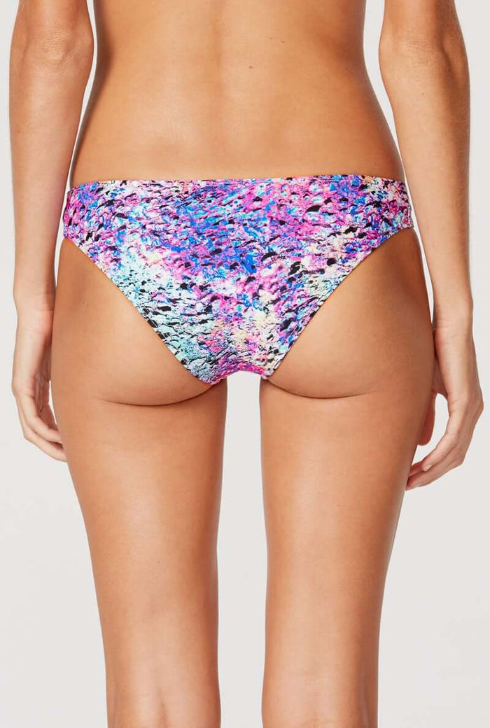 Tide + Seek Sustainable swimwear model wearing Purple Lava Classic Cut Bikini Bottom back view