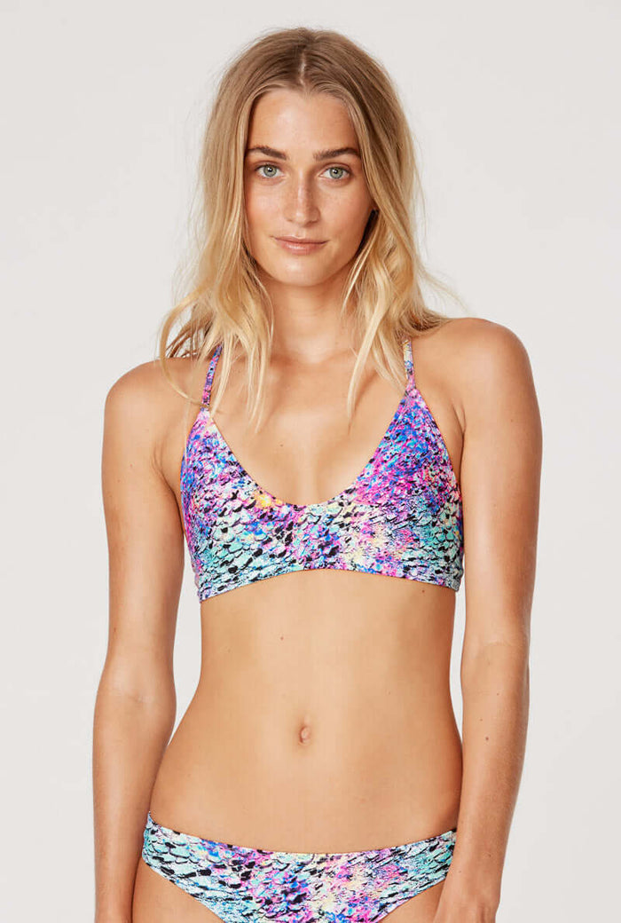 Tide + Seek Sustainable swimwear model wearing our Purple Lava Surf Bralette and Classic Cut Bikini Bottom