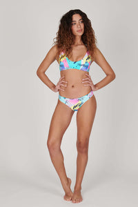 Tide + Seek Sustainable swimwear model wearing Saved By The Bell Surf Bralette Bikini Top and classic cut bikini bottoms