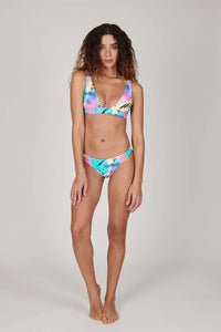 Tide + Seek Sustainable swimwear model wearing Saved By The Bell Triangle Plunge Bikini Top and cheeky cut bikini bottoms