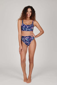 Tide + Seek Sustainable swimwear model wearing Tropic Rave Fitness Bikini Top and High Waisted Bikini Bottoms