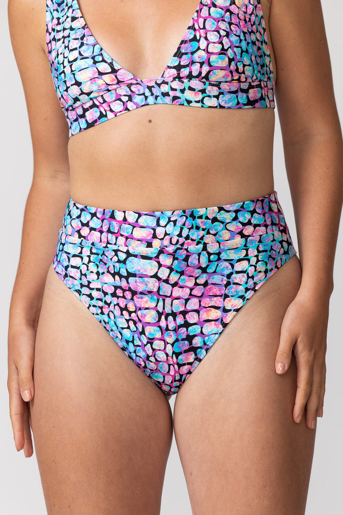 Tide and Seek sustainable swimwear close up view of high waisted bikini bottoms in gone wild