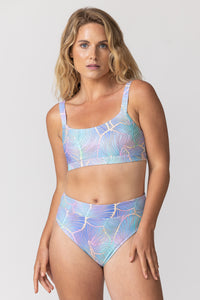 Holo Daze fitness bikini top and high waisted bikini bottoms on tide and seek sustainable swimwear model