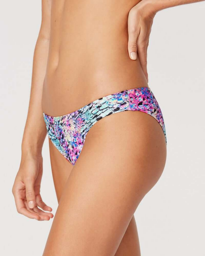 Tide + Seek Sustainable swimwear model wearing Purple Lava Classic Cut Bikini Bottom side view